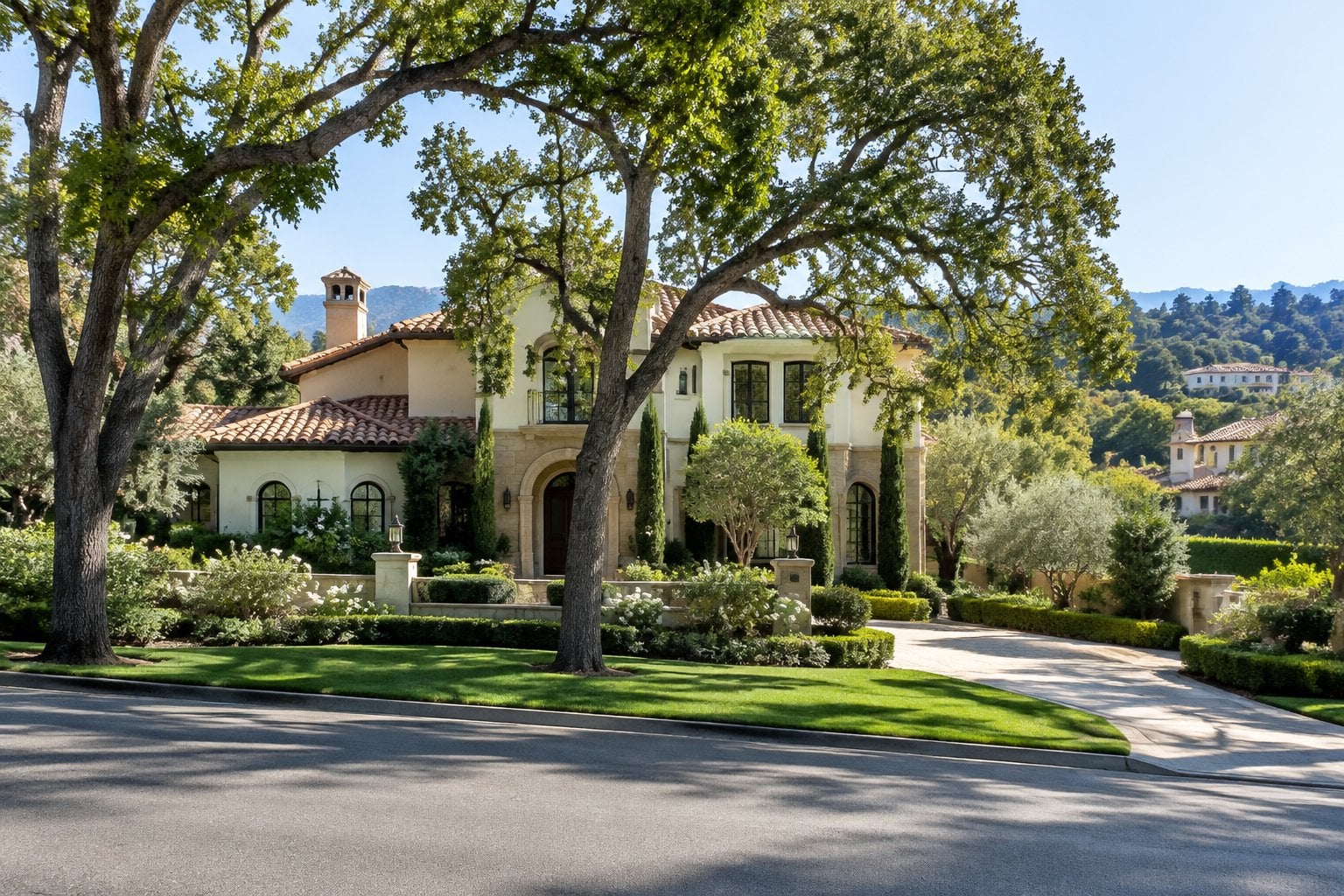 A large estate surrounded by trees and manicured gardens in an affluent suburb.